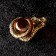 Souvenir "Snake with a ball", brass, amber, 2x2x3 cm