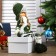 Interior doll "Girl with pigtails in a green coat and green hat" 36x8x13 cm