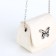 Female bag on a magnet, white color