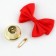 A bell on a pin with a bow for graduation, red, d = 2.6 cm