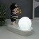 Souvenir Polystone Light "Baby in a black cap, with a gold bubble at the ball" 16.5x8x16 cm