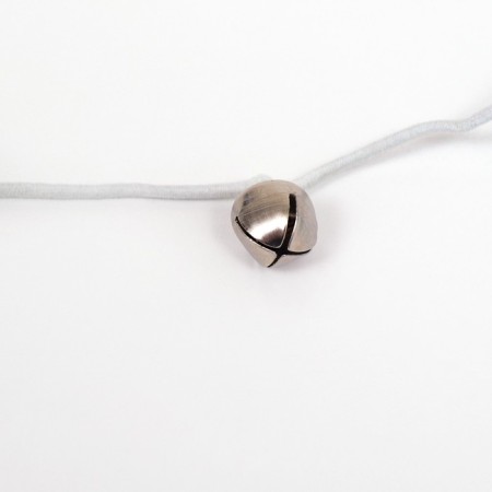 A teaser-pitch with a wicker ball and colored feathers on a wooden handle, orange-2