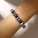 Skull bracelet cartoon, black and white color, d = 6 cm