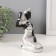 Polystone souvenir "African in a dress with leaves, with a jug, sits" silver 10.5x9x16 cm