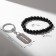 Set 2 objects: bracelet, keychain "blade", black color in silver