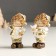 Polystone souvenir "Baby in a gold caftan and cap, with a bird/gift" Mix 4x5x10 cm 94988