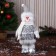 Soft toy "Snowman in the cap and scarf, long legs" stands, white-gray