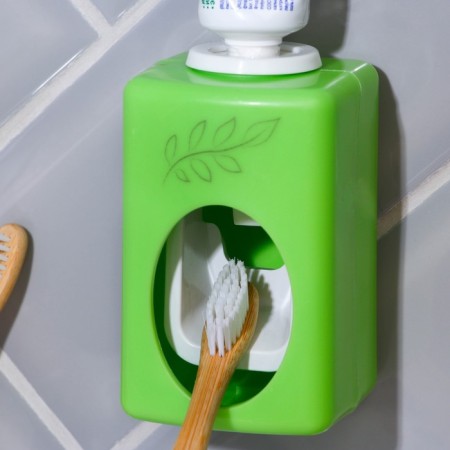 Mechanical “Leaves” dispenser for toothpaste, 9.5 x 5.8 cm.
