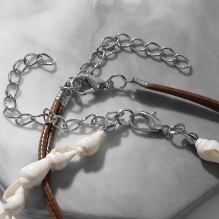 Bracelets on the leg "shells", white-brown color in silver-1