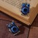 Brooch-reinforcing owl eyes, blue color in black silver (indivisible packing 12 pcs., Price per pcs.)