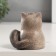 Ceramics bell "Gray cat with hanging paws" 6.8x8.1x8.2 cm