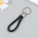 Keychain metal to the leatherette "strap" black 10x4 cm