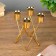 Summary metal for 4 candles "triangles" gold 14x9x9 cm