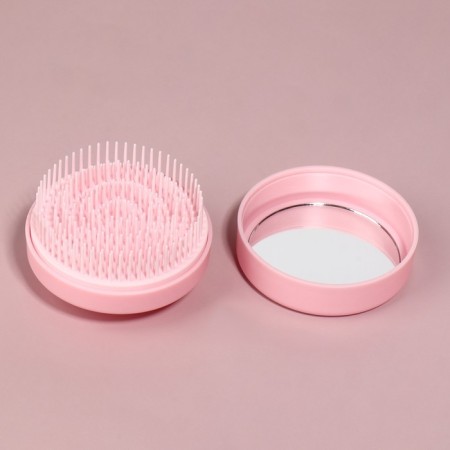 The comb is massage, round, folding, with a mirror, d = 7.5 cm, in the box, the color is pink-12
