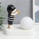 Souvenir Polystone Light "Baby in a black cap, with a gold bubble at the ball" 16.5x8x16 cm
