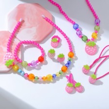 The kit of children's “chosen” 9 objects: rim, 2 elastic bands, 2 hairpins, clips, pendants, bracelet, ring, berries, color mix