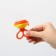 A feeding product with a silicone mesh, a rotating piston, color orange color