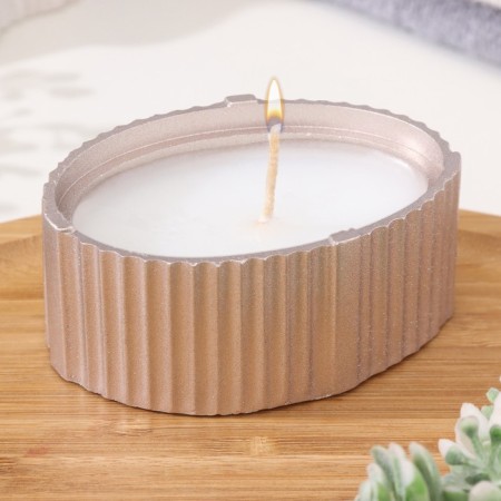 Candle "Oval" in a candlestick with narrow faces, 9x6.5x4cm, champagne