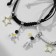 Bracelets "Demetrons" astronauts with stars, black and white color, 7 cm