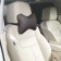 Siger pillow "Automobile Bone", on a car's headrest, perforated eco -leather, black