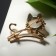 Brooch "cat" in a jump, white color in gold