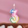 Candle for cake the number "3" color strip