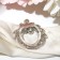 Clip for a “flower” scarf, white-blue color in gray metal