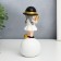 Polystone souvenir "Baby in a black hat, with a gold bubble on the ball" 15x7x7 cm