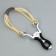 The slingshot "Dragon's Eyes" Metal in a braid, with a triple tourniquet