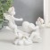 Polystone souvenir "Angels in pink wreaths swing on a rocking chair" 10x11x4.5 cm