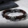 Bracelet Skin Skull is large, with bones, dark brown color with black silver, 8 cm