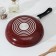 The “Expert” pan, D = 24 cm, plastic handle, anti -stick coating, burgundy color