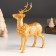Souvenir Polystone "Golden Deer with a wreath on the neck" 11.8x5.7x16.8 cm