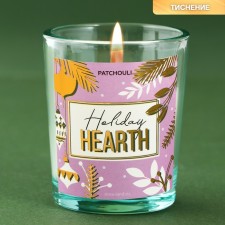 New Year's candle in a glass with a surprise inside 