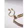 Bracelet with rhinestones "shine" on a puff, the color is white in gold