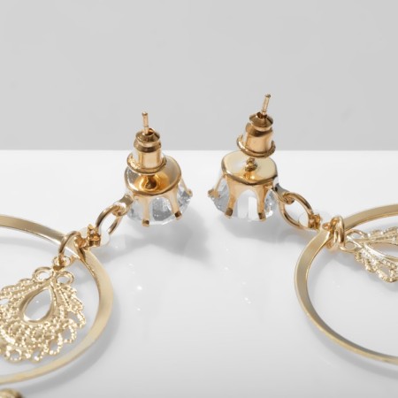 Earrings hanging "drops" openwork on rings, white color in gold, 11.5 cm-1