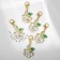 Charm "Flower" rose with a curl, the color is green and white in gold