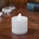 The candle is LED, burning yellow