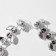 Hanging earrings with rhinestones "Blink" with leaves, white color in silver, 8 cm