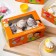 Packaging for 6 cupcakes with the window "Love is...", orange, 25 x 17 x 10 cm