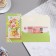 Money envelope "Universal" bouquet, green frame, 18.5x8.5 cm