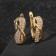 Earrings with rhinestones "Magic" Infinity, white color in gold