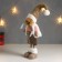 Interior doll "Boy in a white vest and beige cap" 48x10x15 cm