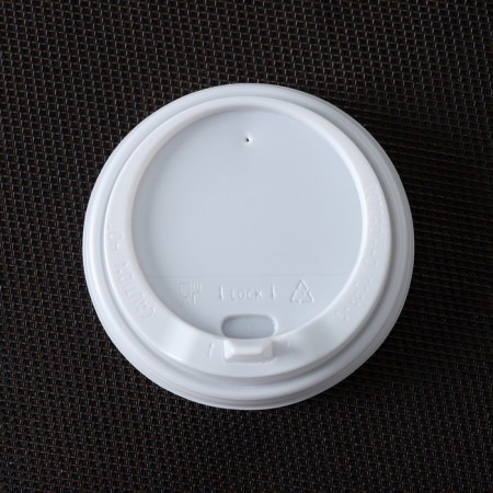A plastic disposable lid for a white glass, with a valve, d = 8 cm-2