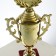 Cup 014, award figure, gold, plastic stand, 32.5 × 16 × 8.5 cm.