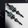 Clips "openwork" drops with curls, emerald color in ferrous metal