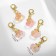 Charm "fruit", pink color in gold
