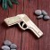 Souvenir wooden pistol is an elastic band, shoots with elastic bands