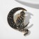 Icon "cat on the moon", black color in gold