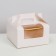 The box is folding, with a window and a handle, white, 16 x 16 x 9 cm